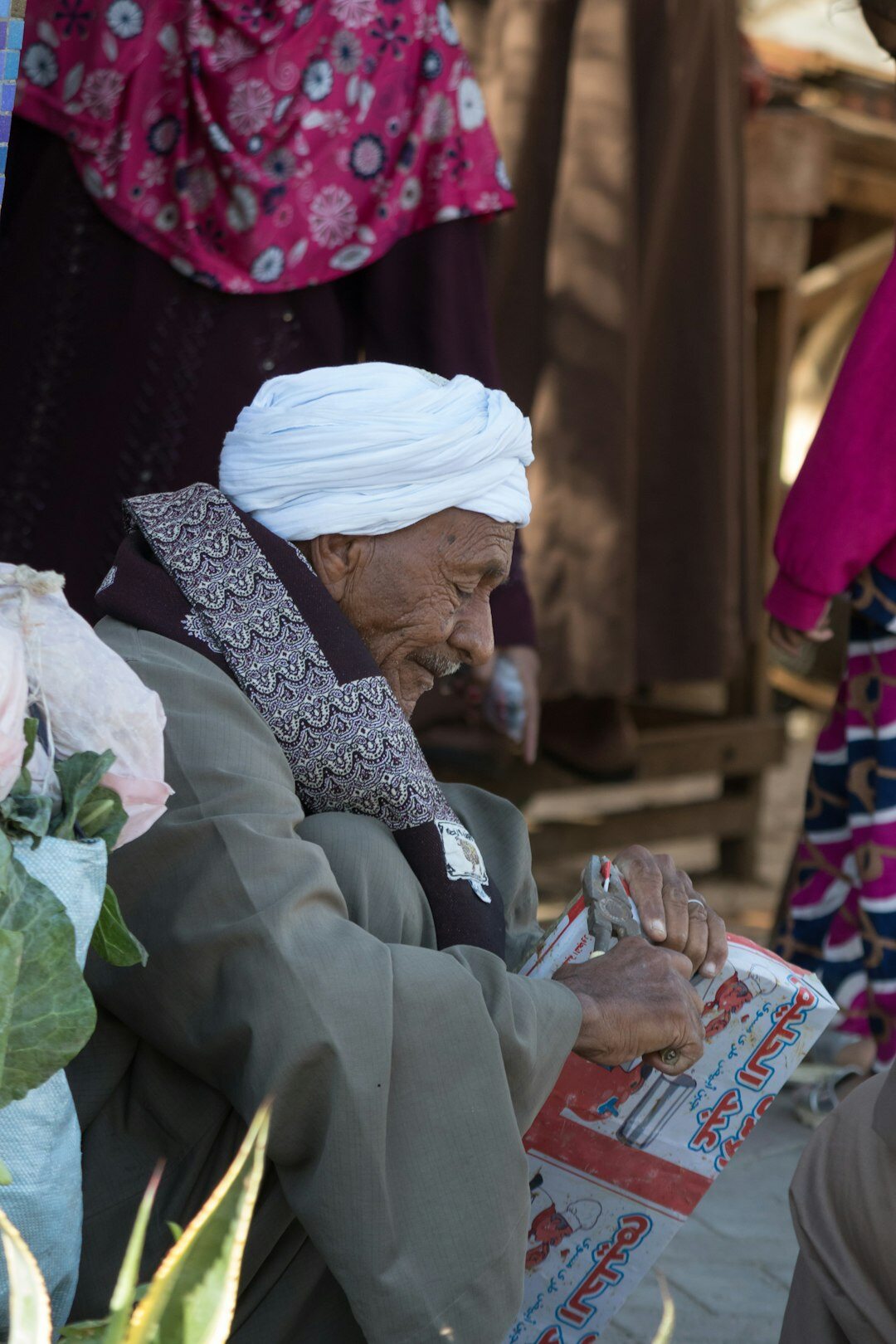elderly couple reading newspaper