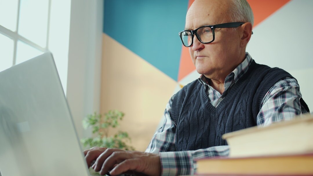 elderly person using computer