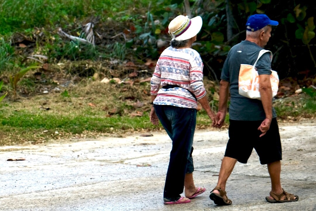 elderly couple walking outdoors