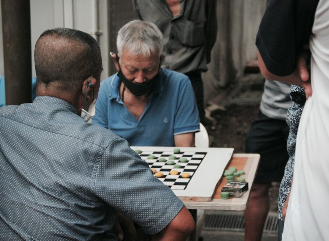 elderly group playing chess
